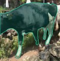 Reference: the highlighted cow from Figure 1, among rocks and other cattle